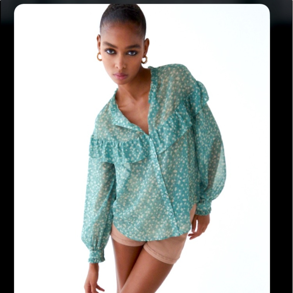 Zara’s ruffled printed blouse